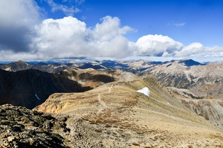 Brown and white mountains under white clouds in Colorado