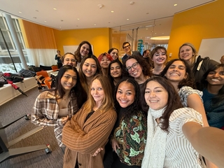 Students pose with fashion icon Stella McCartney